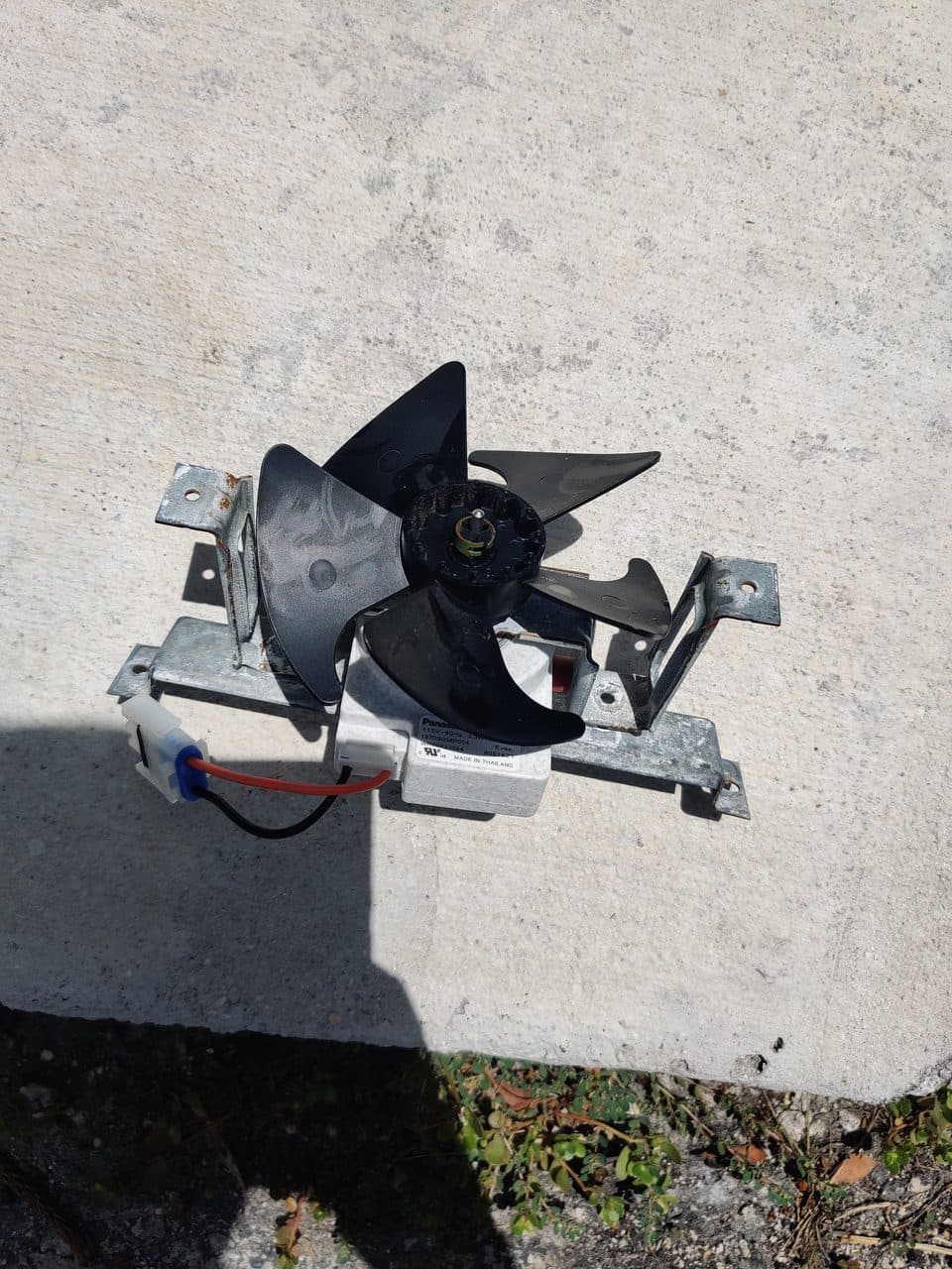 Old evaporator fan motor: GE refrigerator, model GTS18GSHJRSS (refrigerator repair in Doral, FL, August 2026)