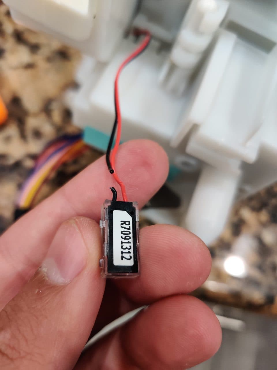 Ice level sensor from the ice maker: Samsung refrigerator, model RF263BEAESR (refrigerator repair in Hialeah, FL, September 2026)