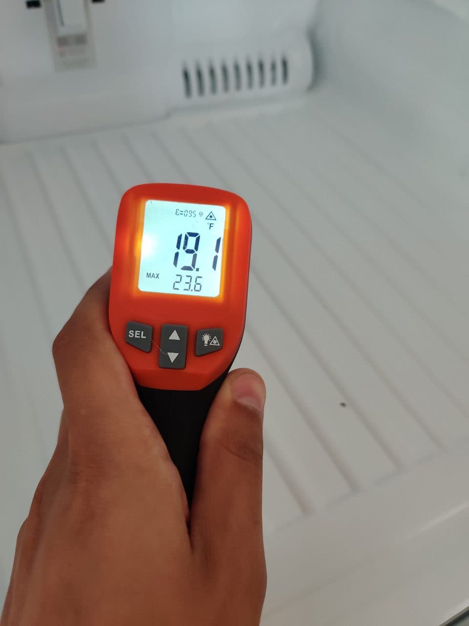 Infrared thermometer reading 19°F inside a freezer